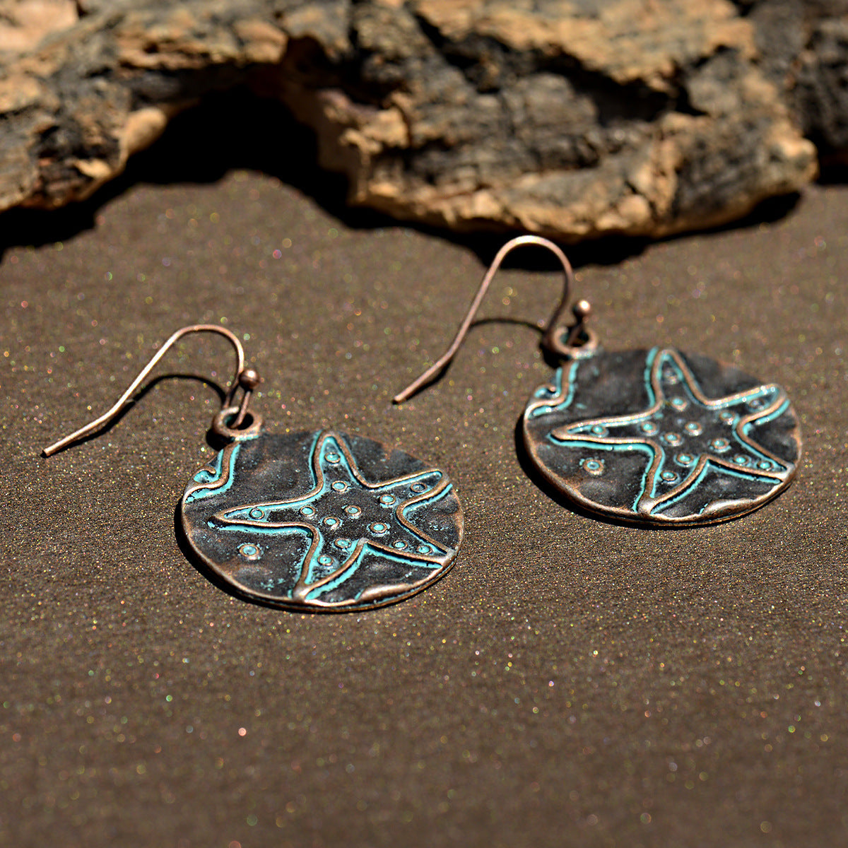 Pendientes redondos de aleación de zinc turquesa con diseño de estrella de mar