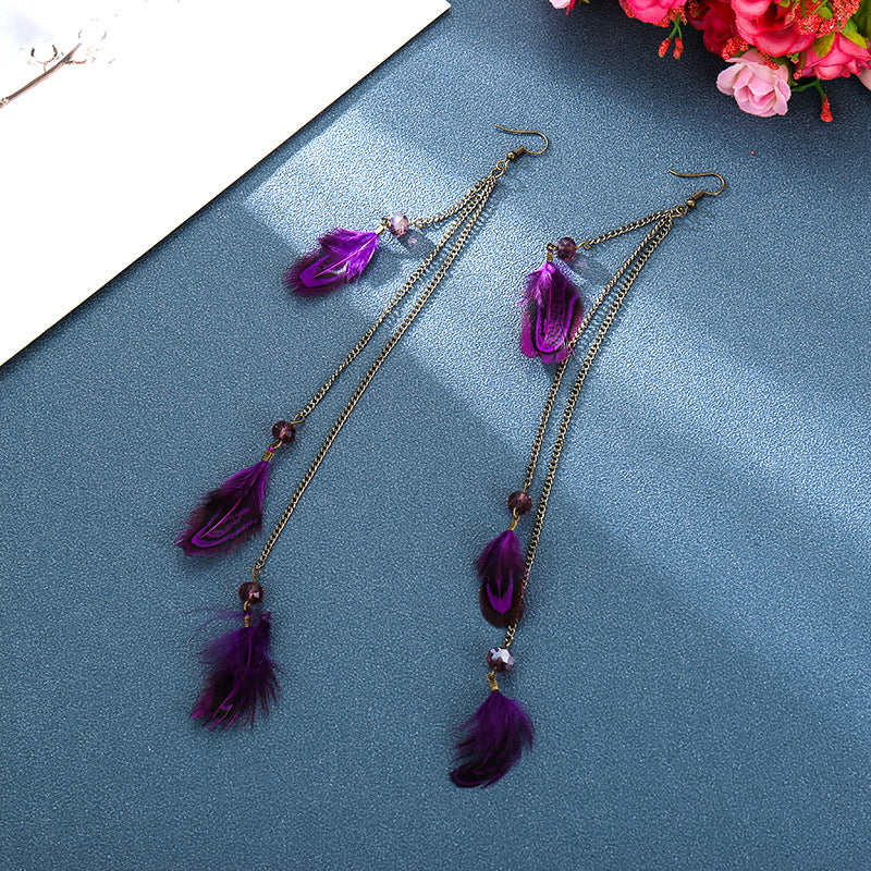 Pendientes colgantes de plumas moradas - NUEVO 521